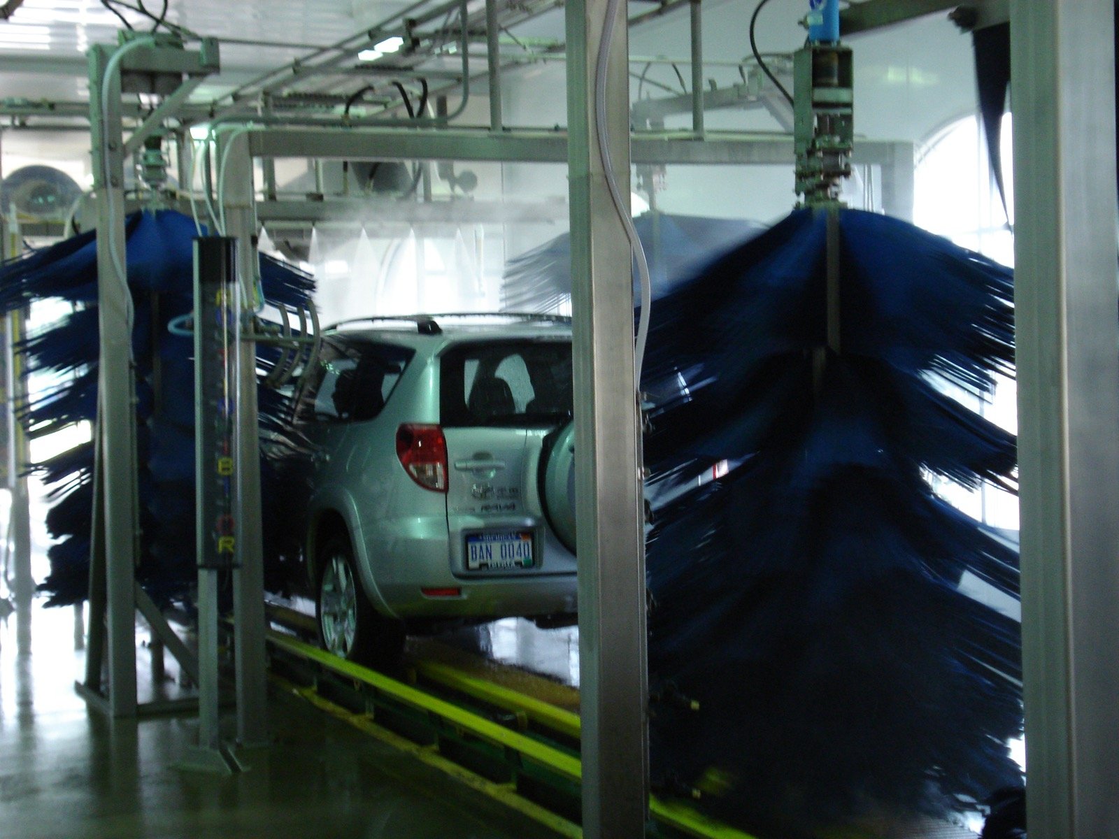 Car passing through an automatic wash bay